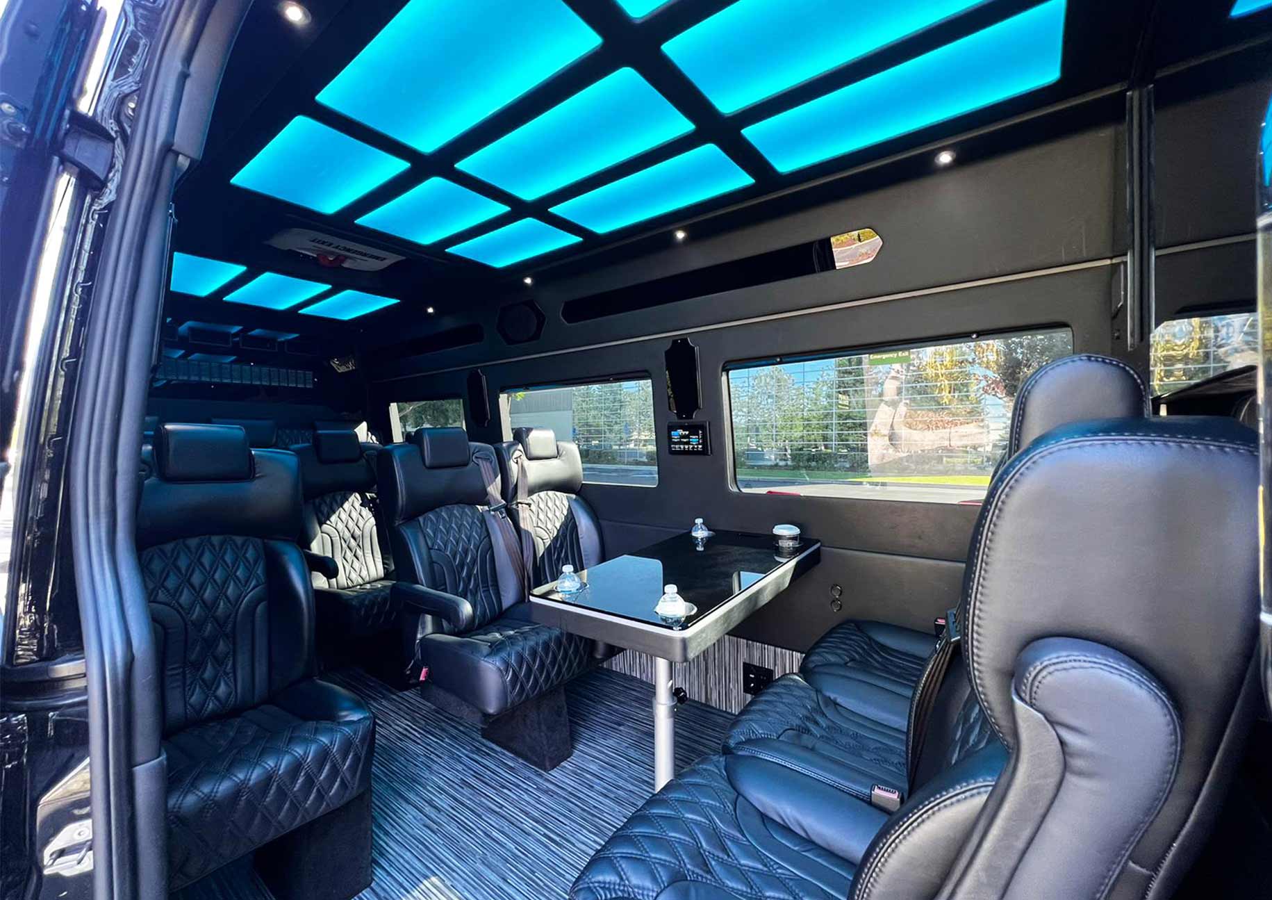 Executive Sprinter interior with captain's chairs and aisle