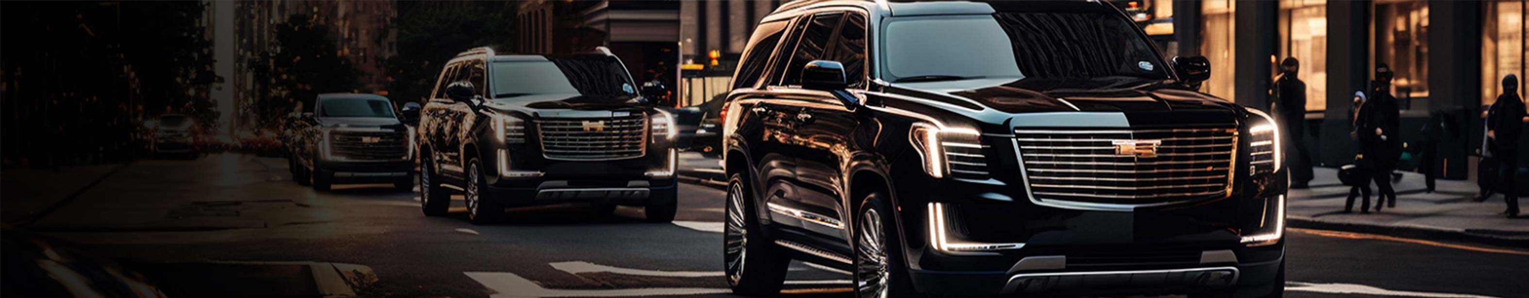 A fleet of black luxury SUVs driving through a city street at dusk, showcasing professional black car service in San Francisco for Super Bowl and VIP transportation